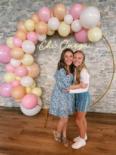 two girls pose in front of a backdrop with balloons and a neon sign Sorority Backdrop, Circle Backdrop With Balloons, Graduation Board, Frame Backdrop, Graduation Boards, Gold Circle Frames, Party Photo Backdrop, Circle Frame, Photo Corners