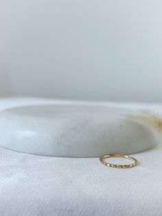 This 14k Ridge Ring is a unique addition to any jewelry box. Carefully carved ridges create a subtle bamboo effect. 14k Solid Gold Width is approximately 1.2mm Each ridge is hand filed into the ring, placement of each may vary slightly Half sizes are available. Simply leave a note with your size during checkout *14k Gold rings are made to order. Please allow an extra 3-4 business days for production.* Ring Placement, 14k Gold Ring, The Ring, Solid Gold, Gold Filled, Jewelry Box, Gold Rings, Bamboo, Sterling Silver