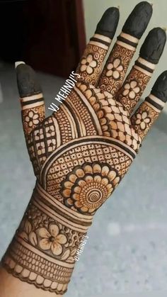 the hand is decorated with intricate designs