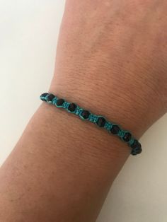 "SPECIAL OFFER!! Buy TWO get ONE for FREE!! of equal or lesser value (please, don't add your free product to your shopping cart or you will be charged for it. Pick 1 product and leave the full name of it in the \"Note to enjoywelrydesign\" Box during checkout.) This is a turquoise macrame bracelet with black crystal beads. Protect yourself from selfishness and negativity with this Kabbalah bracelet. The simplicity of this bracelet make it easy to match. And also very elegant. The bracelet is adj Black Beaded Bracelets With Adjustable Cord As Gift, Black Beaded Bracelet With Adjustable Cord As Gift, Adjustable Black Beaded Round Bracelet, Adjustable Round Black Beaded Bracelet, Trendy Adjustable Beaded Bracelets With Black Beads, Casual Friendship Bracelets With Black Beads As Gift, Trendy Black Jewelry With Adjustable Cord, Trendy Adjustable Bracelet With Black Beads, Black Beaded Bracelet With Sliding Knot For Friendship