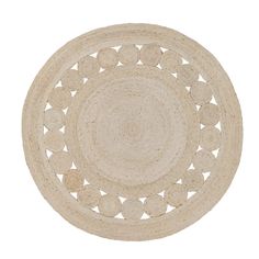 a white round rug with circles on it