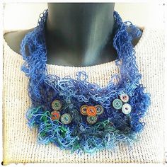 Designed as an unique, one of a kind piece this adorable linen necklace will add special and original touch to your outfit. The statement is eye catching, attractive and easy to wear.  Materials: This necklace is entirely handmade piece using high quality pure linen yarn and vintage, wooden buttons in matching colours.  Color: blue exterior beautifully finished with  blue- green, orange buttons. Length approximately: 22 inches.  Closer: wooden button and loop.  It comes beautifully wrapped ready Artisan Handwoven Blue Jewelry, Blue Artisan Handwoven Jewelry, Unique Handwoven Jewelry Gift, Unique Handwoven Jewelry As Gift, Unique Handwoven Necklaces For Gifts, Handmade Green Artsy Necklace, Artisan Blue Jewelry With Fair Trade, Unique Handmade Blue Necklaces, Unique Handwoven Turquoise Jewelry