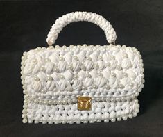 Crocheted handbag (dimensions 24cm x 16cm) with a handle, made out of cotton rope and decorated with glass beadings. Also available in listed colors. Alterations can be made if requested Elegant White Crochet Bag For Daily Use, Handmade White Evening Bag As Gift, Handmade White Evening Bag For Gift, White Top Handle Evening Bag Gift, Handmade White Shoulder Bag For Party, Elegant White Handheld Crochet Bag, Handmade White Pouch Shoulder Bag, White Handmade Handheld Evening Bag, Handmade White Handheld Evening Bag