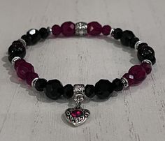 "Beautiful Czech ruby red and jet black glass beads, black and red luster beads and antique silver spacers are paired with a tiny silver heart charm with a rhinestone embellishment to create a fun to wear wrist mala for Valentines or anytime a little extra heart felt Goth vibe is needed. The bracelet is strung on 1mm Stretch Magic cord and easily rolls over your hand to rest on the wrist. I can custom make any size you need. Just select the size you need from the pull down menu or convo me with Dark Beaded Bracelets, Beaded Bracelets String, Goth Bead Bracelet, Goth Bracelets Diy, Black Bracelet Aesthetic, Red And Black Bracelets, Grunge Bracelets, Vampire Bracelet, Goth Bracelets