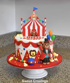 a circus themed birthday cake on a table