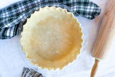 an uncooked pie sitting on top of a table