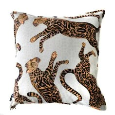 an animal print pillow with leopards on it