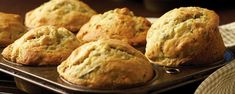 freshly baked muffins sitting in an oven pan