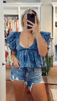 Dive into the summer with The Ocean Eyes Top, a shimmery blue low cut top with ruffled sleeves! This breezy top lets you show off your summer glow, and a little bit of shoulder. 100% Polyester Beachy Blue Printed Tops, Blue Ruffled Crop Top For The Beach, Blue Summer Crop Top With Ruffles, Light Blue Beach Crop Top, Light Blue Off-shoulder Summer Top, Low Cut Top, Event Outfit, Ruffled Sleeves, Navy Tops