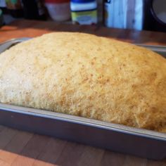 a loaf of bread sitting on top of a metal pan