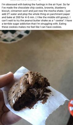 someone is holding a chocolate cookie in their left hand and the recipe on the right