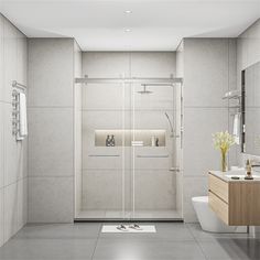 a bathroom with a toilet, sink and shower stall in the middle of the room