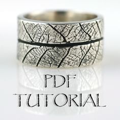 "This tutorial shows how to create a Leaf Textured ring using silver metal clay and a skeleton leaf.  It is written for artists with advance knowledge of working with metal clay and does not review basics, like using natural balms to coat your hands and tools and keeping your clay wrapped any time it is not in use.  Material List:      * 25g of silver metal clay     * 1 large skeleton leaf     * Metal clay syringe (with 22 gauge/blue tip and tip submerged into a container of water)   Tool List:      * Ring mandrel     * Teflon sheet (2 pieces)     * Roller (with thickness guide)     * Tape     * Tissue blade     * Small paint brush (for working with water)     * Large dry paint brush     * Container of water     * Mug warmer     * 600 and 1000 grit sandpaper or sanding pads     * Crossing Precious Metal Clay Tutorial, Metal Clay Rings, Metal Clay Tutorial, Pmc Jewelry, Precious Metal Clay Jewelry, Marriage Celebrant, Silver Metal Clay, Silver Clay, Metal Clay Jewelry