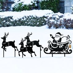 an image of santa riding in his sleigh with reindeers