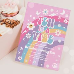 a pink box filled with cupcakes next to a card that says it's grooy