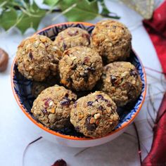 a bowl filled with oatmeal cookies on top of a table