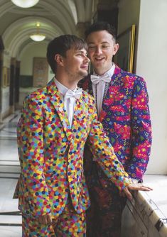 two men in brightly colored suits standing next to each other