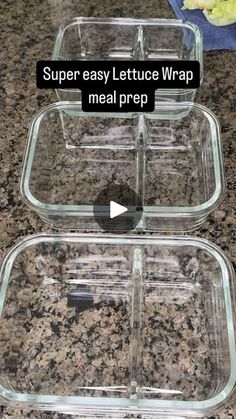 two glass containers with lids on top of a granite counter