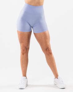 HIGHLIGHTS. High-waisted short 3-tiered tapered waistband. Seamless, knit fabric. No front seam. Back scrunch seam detail to enhance curves. Leg and glute contouring panels. ForeverKnit core logo on waistband 4.5" inseam FIT SUGGESTION. This item runs true to Alphalete’s standard seamless fit.. If you are between sizes, we recommend sizing up.. Model is 5’4”/162.5cm, wearing a size XS with a 26”/66cm waist and 39.5”/100.3cm hips. MATERIALS AND WASHING DIRECTIONS. 51% Polyamide, 38% Polyester, 11 Blue 4-way Stretch Workout Shorts, Seamless Solid Bottoms For Training, Solid Color Shorts With Elastic Waistband And High Stretch, Solid Bottoms With Seamless Construction, Short Shape, Blue 4-way Stretch Activewear Shorts, Compressive Blue Bottoms With Built-in Shorts, Blue Seamless 4-way Stretch Bottoms, Sculpting Bottoms With Built-in Shorts, Sculpting Yoga Bottoms