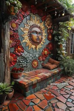 a bench sitting in front of a colorful wall with sunflowers and flowers on it