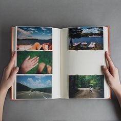 someone holding an open book with pictures in it