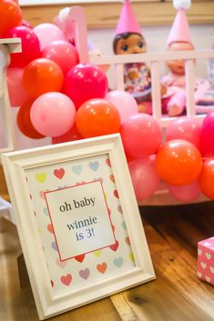 a baby shower party with balloons and decorations