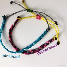 three braided bracelets with the words mini braid written on them in different colors