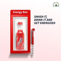 an energy box with a drink in it next to a keychain and chain