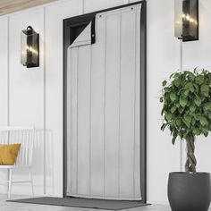 a potted plant sitting in front of a white wall next to an open door