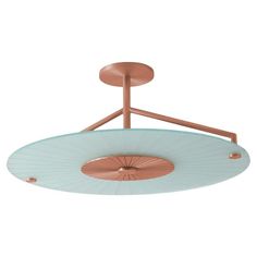 an overhead light fixture with copper and blue shades