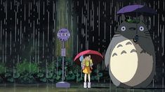 a person holding an umbrella standing in the rain with a totoro behind them