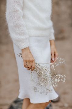 "Handmade mohair silk off white pullover, hand knitted mohair silk soft cardigan, cosy soft mohair oversize pullover, cute mohair silk sweater Sweaters, pullovers , women's sweaters , minimalist sweater, cowl neck sweater, white sweater , mohair-silk sweater, soft pullover, silk sweater, ivory pullover, bridal sweater. 1. HANDMADE 2. COLOR- OFF WHITE 3. YARNS - MOHAIR -75 SILK -25 4. Length of the sweater: 62 cm 5. Width -54 cm. The model is slightly oversize with puffy sleeves and a beautiful r Luxury White Sweater For Daywear, Bridal Sweater, Silk Cardigan, Bridal Shrug, Mohair Cardigan, Soft Cardigan, Wedding Ribbon, Oversized Pullover, White Cardigan