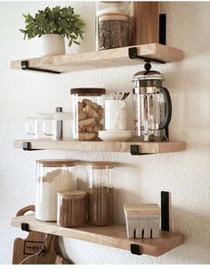 two wooden shelves filled with jars and containers