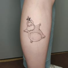 a small rhinoceros tattoo on the leg