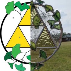 a stained glass window with green leaves on the outside and yellow in the inside side