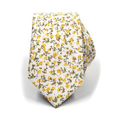 The floral marigold yellow tie rolled up Dapper Cotton Ties For Formal Occasions, Dapper Cotton Tie For Formal Occasions, Formal Dapper Cotton Ties, Elegant Cotton Suit And Tie Accessories For Wedding, Elegant Cotton Ties For Spring, Dapper Cotton Suit And Tie Accessories For Formal Occasions, Elegant Cotton Suit And Tie Accessories For Summer, Classic Cotton Suit And Tie Accessories For Semi-formal, White Cotton Ties For Formal Occasions