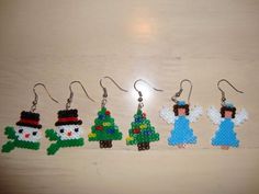 the beaded christmas tree earrings are made from plastic beads and have snowmen on them