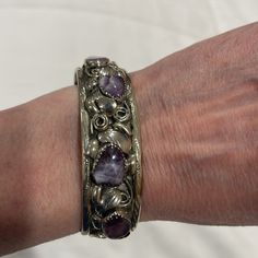 Vintage Sterling Silver Cuff Bracelet Purple Stones- Charoite? Marked With Artist’s Initials- Lt 2 Middle Stones Are Opaque And 2 End Stones Are More Transparent/See Through. See All Pictures Please. Beautiful Silver Work With 3d Swirls And Leaves! Fits Average Sized Wrist. Measured Appx. 5 5/8” End To End With 1 1/4” Gap Formal Silver Amethyst Bracelet, Collectible Silver Bracelets With Natural Stones, Elegant Silver Multi-stone Cuff Bracelet, Formal Silver Cuff Bracelet With Gemstone, Silver Gemstone Cuff Bracelet For Formal Occasions, Formal Bangle Bracelet With Natural Stones, Elegant Silver Amethyst Cuff Bracelet, Silver Multi-stone Cuff Bangle, Formal Multi-stone Sterling Silver Bracelet