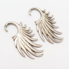 925 Sterling Silver Angel Wings Design Statement Earrings Weight: 29.9g WELCOME TO PAWN SHOP We are an actual pawn shop and have been in business for over 25 years. Since 1990, our establishment has been serving a variety of clients by providing them with short term cash solutions and options of liquidity regarding their treasured heirlooms. Acknowledging that today′s customers are very sophisticated and are looking for a variety of investments, our acquisitions are hand-picked for our special c Silver Dangle Cartilage Earrings For Anniversary, Angel Wings Design, Silver Angel Wings, Mens Ring Sizes, Wings Design, Design Statement, Miraculous Medal, Pawn Shop, Hand Picked