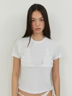 This is a casual and feminine top by MORE THAN PARADISE that is made out of high quality and sturdy material. With distinctive mood of the design and comfortable wear, you can style it for your casual daily outfit.- Halter neck bra top layered- Embroidery and silver hardware on the chest- Trendy, casual and feminine mood Chic Tops With Built-in Bra For Layering, Trendy Cotton Tops With Built-in Bra, Cropped Cotton Tops With Built-in Bra, Triangle Top With Built-in Bra For Day Out, Chic Cropped Bra-friendly Tops, Chic Cropped Bra Friendly Tops, Summer Fitted Top Bra Friendly, Fitted Bra Friendly Top For Summer, Bra-friendly Tops For Summer Day Out