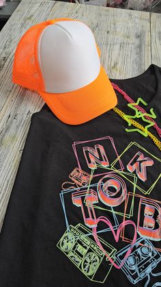 NKOTB tank or Tee with a neon vibe!  Perfect for the Magic Summer Tour.  Order yours today! Neon T-shirt With Graphic Print For Summer, Neon Graphic Print T-shirt For Summer, Black Rave Tops With Letter Print, Black Rave Top With Letter Print, Neon Summer T-shirt With Graphic Print, Black Rave T-shirt For Summer, Neon Tops With Graphic Print For Summer, Neon Graphic Print Top For Summer, Neon Casual T-shirt With Screen Print