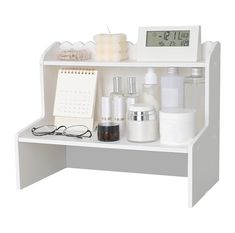 a white shelf with various items on it