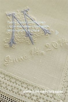 an embroidered tablecloth with the words love and date written on it's side