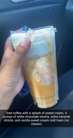 a person holding up a plastic cup with liquid in it and the caption reads iced coffee with a splash of sweet cream, 4 pumps of white chocolate macha