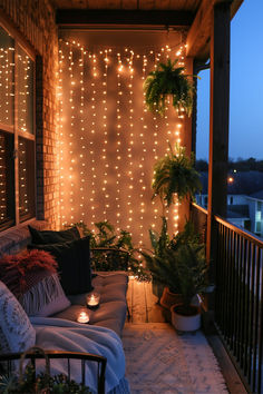 A warm and inviting balcony decorated with LED curtain lights and plants, showcasing Balcony LED Lighting Ideas. Plants And Lights Decor, Balcony Light Ideas, Small Balcony Lights, Ideas For Balcony Small Spaces, Fairy Lights On Porch, Fairy Light Balcony, Led Lights Balcony, Apartment Patio Lighting Ideas, Balcony Fairy Lights Ideas