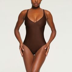 Wear this sexy plunge neck thong bodysuit alone with your favorite bottoms or under dresses to accentuate your curves and snatch your silhouette. Featur... Under Dress, Womens Bodysuit, Shapewear, Cocoa, Lounge Wear, Dresses, How To Wear, Quick Saves