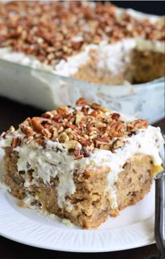 a piece of cake with nuts and cream on top