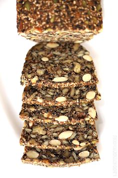 some kind of food that is stacked on top of each other with nuts and seeds