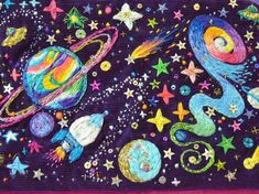 an image of a space themed placemat with stars and planets on purple fabric background