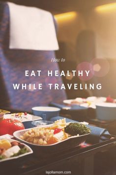 a tray full of food with the words how to eat healthy while traveling on it